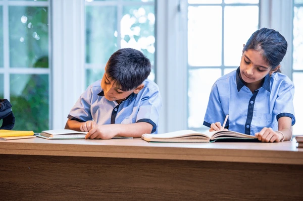 indian school kids studying together 600nw 2691937219 1
