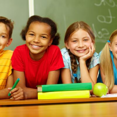 smiling primary students sitting class 1098 3953